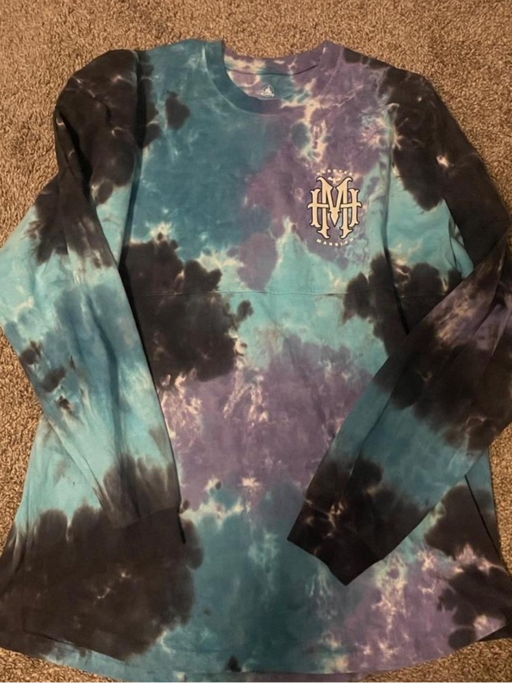 Disney Haunted Mansion glow in the dark tie-dye spirit jersey.